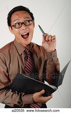 Businessman with notebook and pen, looking away, mouth open View Large Photo Image Stock Photography - Businessman with notebook and pen, looking away, mouth open. Fotosearch