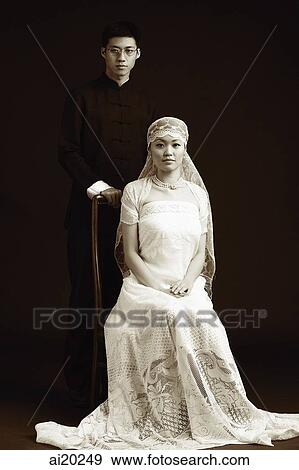 Couple posing for studio portrait View Large Photo Image Stock Photo - Couple posing for studio portrait. Fotosearch