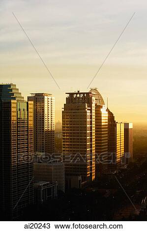 Late afternoon sun reflects off office buildings and skyscrapers along Jalan Jend Sudirman, Jakarta View Large Photo Image Stock Image - Late afternoon sun reflects off office buildings and skyscrapers along Jalan Jend Sudirman, Jakarta. Fotosearch
