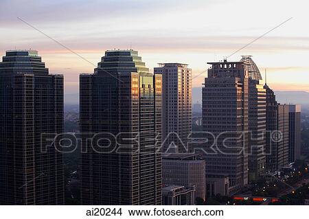 Late afternoon view of office buildings and skyscrapers along Jalan Jend Sudirman, Jakarta View Large Photo Image Picture - Late afternoon view of office buildings and skyscrapers along Jalan Jend Sudirman, Jakarta. Fotosearch