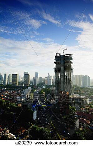 Late afternoon view of the CBD with building construction and office skyscrapers along Jalan Jend Sudirman, Jakarta View Large Photo Image Stock Photo - Late afternoon view of the CBD with building construction and office skyscrapers along Jalan Jend Sudirman, Jakarta. Fotosearch