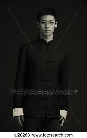 Man in traditional attire, studio shot View Large Photo Image Stock Image - Man in traditional attire, studio shot. Fotosearch