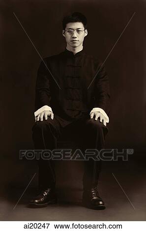 Stock Photo - Man sitting for studio portrait. Fotosearch