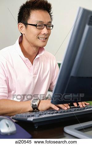 Man using computer View Large Photo Image Stock Photography - Man using computer. Fotosearch