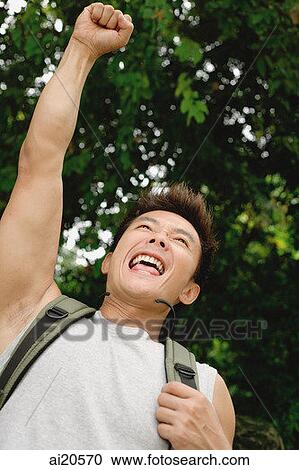 Man with backpack, arms outstretched, smiling View Large Photo Image Stock Image - Man with backpack, arms outstretched, smiling. Fotosearch