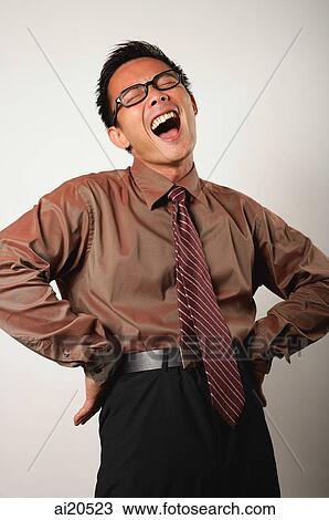 Nerdy businessman with hands on hips, laughing View Large Photo Image Stock Image - Nerdy businessman with hands on hips, laughing. Fotosearch