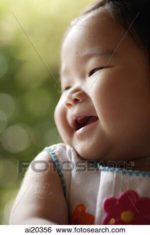 Portrait of baby girl, looking away, smiling View Large Photo Image Stock Photograph - Portrait of baby girl, looking away, smiling. Fotosearch