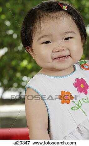 Portrait of baby girl, smiling at camera View Large Photo Image Stock Photo - Portrait of baby girl, smiling at camera. Fotosearch