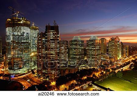 Stock Photograph - Sunset view of office buildings and construction along Jalan Jend Sudirman, Senayan, Jakarta. Fotosearch