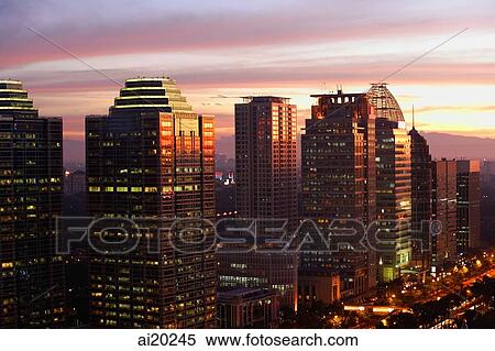 Sunset view of office buildings and skyscrapers along Jalan Jend Sudirman, Senayan, Jakarta View Large Photo Image Stock Photography - Sunset view of office buildings and skyscrapers along Jalan Jend Sudirman, Senayan, Jakarta. Fotosearch