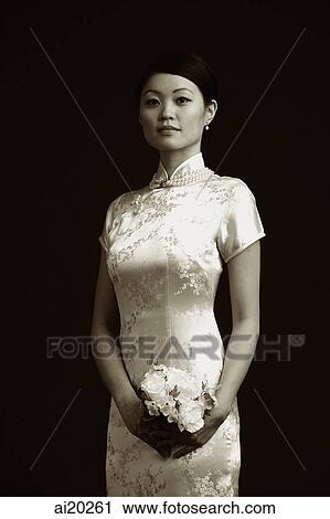 Woman in cheongsam holding bouquet of flowers, portrait View Large Photo Image Stock Image - Woman in cheongsam holding bouquet of flowers, portrait. Fotosearch