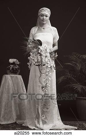 Woman in wedding gown, looking at camera, portrait View Large Photo Image Stock Photography - Woman in wedding gown, looking at camera, portrait. Fotosearch