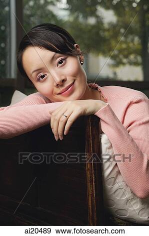 Stock Photo - Woman smiling at camera, portrait. Fotosearch