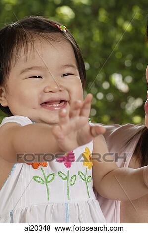 Young girl smiling View Large Photo Image Stock Photo - Young girl smiling. Fotosearch