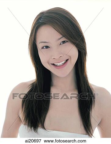 Young woman with long straight hair smiling at camera View Large Photo Image Stock Photo - Young woman with long straight hair smiling at camera. Fotosearch