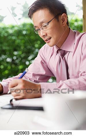 Businessman holding pen View Large Photo Image Stock Image - Businessman holding pen. Fotosearch