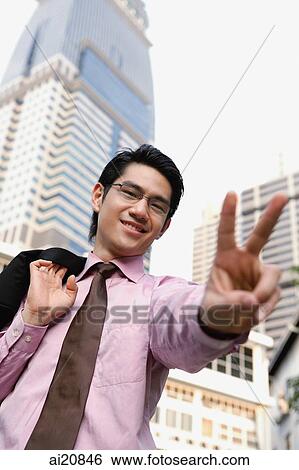 Stock Photograph - Businessman making hand sign. Fotosearch