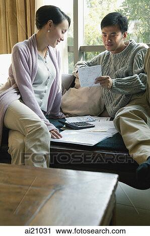 Couple at home doing finances View Large Photo Image Stock Image - Couple at home doing finances. Fotosearch