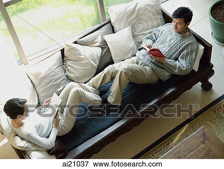Couple at home, reading View Large Photo Image Stock Photo - Couple at home, reading. Fotosearch