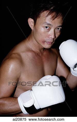 Stock Photography - Male boxer looking at camera. Fotosearch
