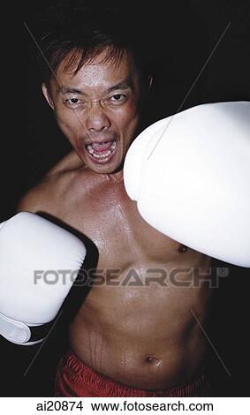 Male boxer throwing punch View Large Photo Image Picture - Male boxer throwing punch. Fotosearch