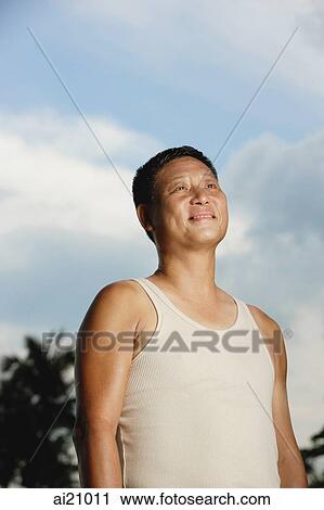 Mature adult in tank top, looking away View Large Photo Image Stock Image - Mature adult in tank top, looking away. Fotosearch