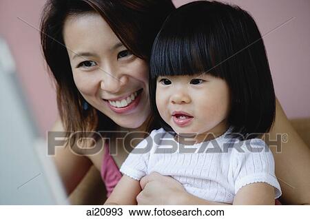 Mother with young daughter, portrait View Large Photo Image Stock Image - Mother with young daughter, portrait. Fotosearch