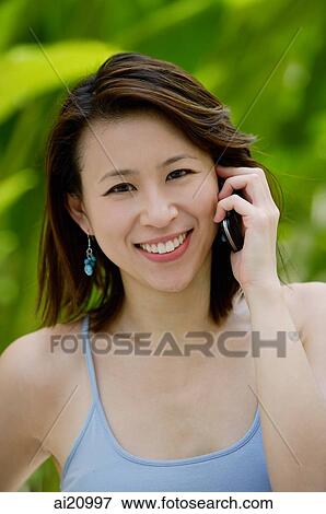 Woman using mobile phone View Large Photo Image Stock Photo - Woman using mobile phone. Fotosearch