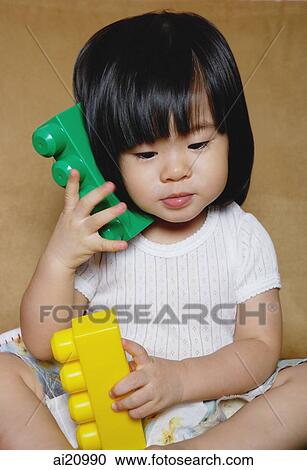 Young girl playing with toys View Large Photo Image Stock Image - Young girl playing with toys. Fotosearch