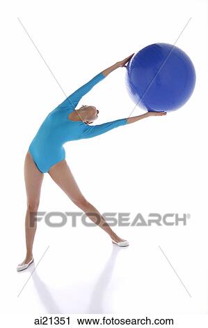 Gymnast exercising with fitness ball View Large Photo Image Stock Image - Gymnast exercising with fitness ball. Fotosearch