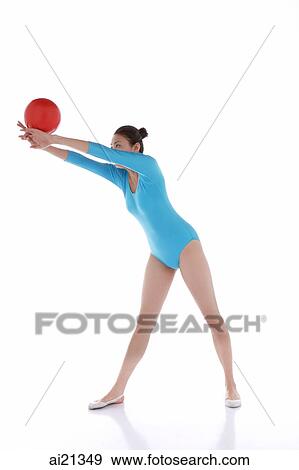 Gymnast performing rhythmic gymnastics with ball View Large Photo Image Stock Photo - Gymnast performing rhythmic gymnastics with ball. Fotosearch
