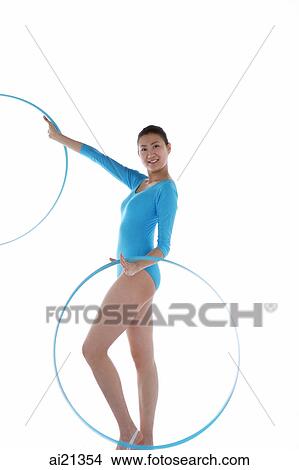 Rhythmic gymnast performing with hoop View Large Photo Image Picture - Rhythmic gymnast performing with hoop. Fotosearch