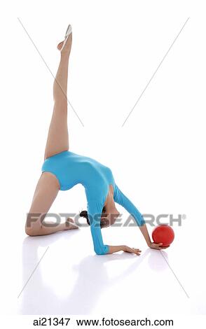 Rhythmic gymnastics, woman doing routine with ball View Large Photo Image Stock Photo - Rhythmic gymnastics, woman doing routine with ball. Fotosearch