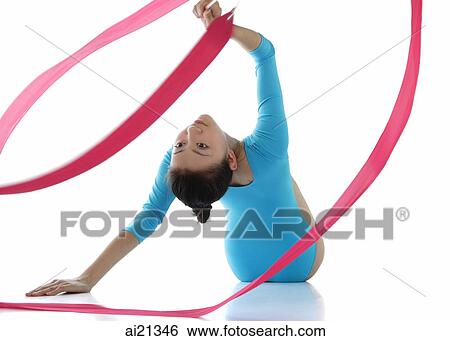 Rhythmic gymnastics, woman doing routine with ribbon View Large Photo Image Stock Photograph - Rhythmic gymnastics, woman doing routine with ribbon. Fotosearch