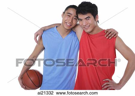 Two basketball players, with arms around each other, looking at camera View Large Photo Image Stock Image - Two basketball players, with arms around each other, looking at camera. Fotosearch