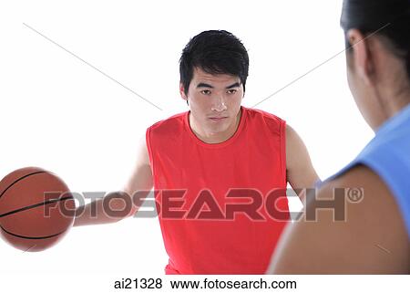 Two men playing basketball, over the shoulder view View Large Photo Image Stock Photo - Two men playing basketball, over the shoulder view. Fotosearch