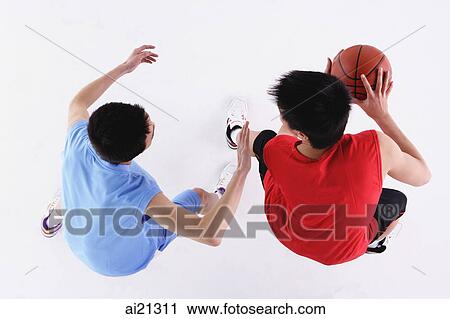 Two men playing basketball View Large Photo Image Stock Image - Two men playing basketball. Fotosearch