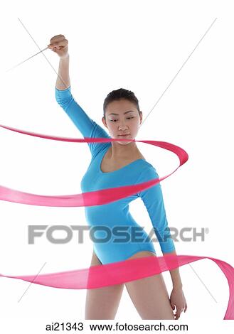 Woman holding ribbon, performing rhythmic gymnastics View Large Photo Image Stock Image - Woman holding ribbon, performing rhythmic gymnastics. Fotosearch