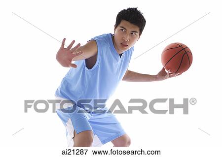 Young man holding basketball View Large Photo Image Stock Photo - Young man holding basketball. Fotosearch