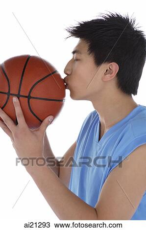 Young man kissing basketball View Large Photo Image Stock Image - Young man kissing basketball. Fotosearch