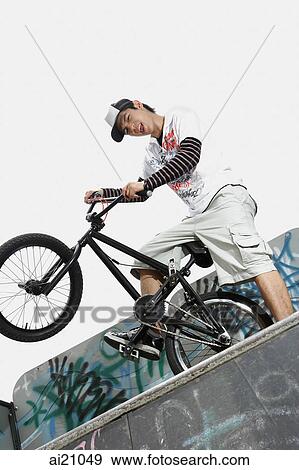 Young man on bicycle View Large Photo Image Stock Photo - Young man on bicycle. Fotosearch