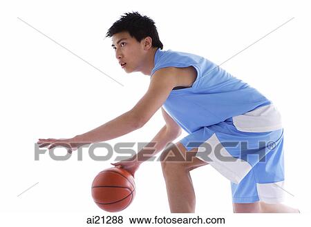 Young man playing basketball View Large Photo Image Stock Photo - Young man playing basketball. Fotosearch