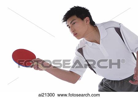 Young man playing table tennis View Large Photo Image Stock Image - Young man playing table tennis. Fotosearch