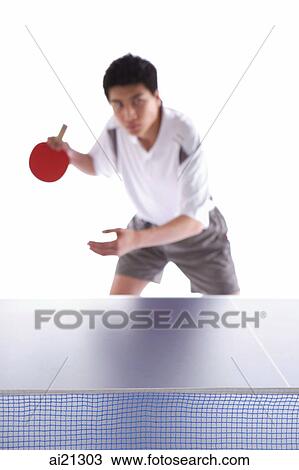 Young man playing table tennis View Large Photo Image Stock Image - Young man playing table tennis. Fotosearch
