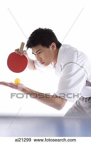 Young man playing table tennis, preparing to serve View Large Photo Image Stock Photo - Young man playing table tennis, preparing to serve. Fotosearch