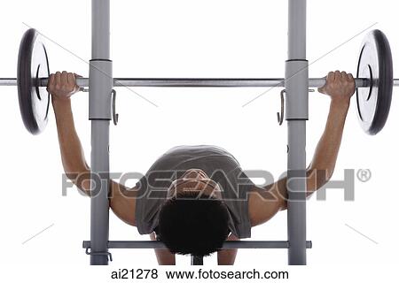 Young man weight training View Large Photo Image Stock Photo - Young man weight training. Fotosearch