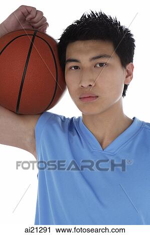 Young man with basketball, portrait View Large Photo Image Stock Image - Young man with basketball, portrait. Fotosearch