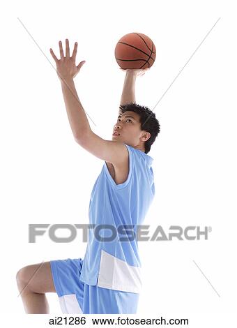 Young man with basketball, preparing to throw ball View Large Photo Image Stock Photograph - Young man with basketball, preparing to throw ball. Fotosearch