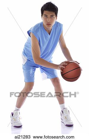 Young man with basketball View Large Photo Image Stock Image - Young man with basketball. Fotosearch