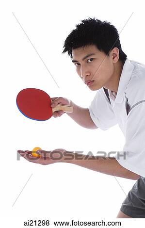 Young man with table tennis paddle and ball, preparing to serve View Large Photo Image Stock Photo - Young man with table tennis paddle and ball, preparing to serve. Fotosearch